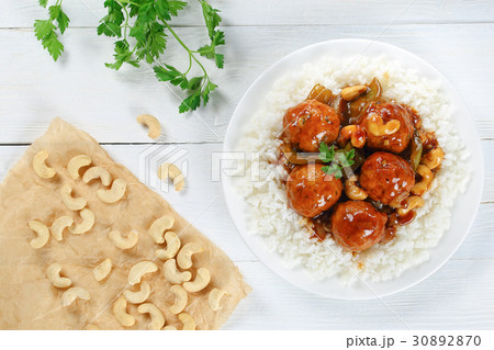 rice topped with Chicken meatballs 30892870
