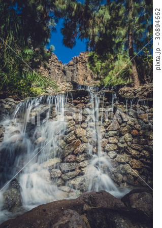 Small waterfall in the Palmitos Park in Gran Canaria Small waterfall in the Palmitos Park in Gran Canaria 30894662