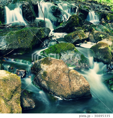 Beautiful nature with a river of rocks and forest. Beautiful nature with a river of rocks and forest. 30895335