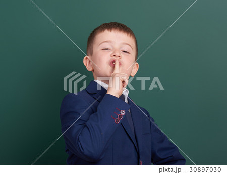 school boy portrait near green blank background school boy portrait near green blank background 30897030