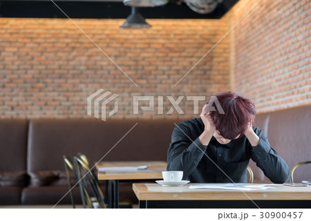 business man sitting in depression 30900457