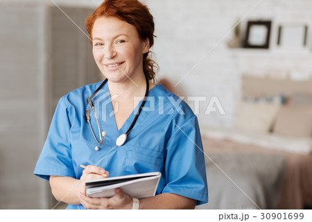 Cheerful excellent doctor holding consultation at 30901699