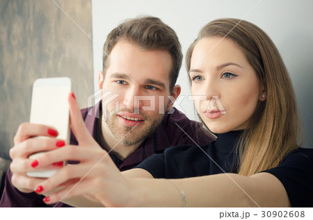 Young couple taking a selfie photo 30902608