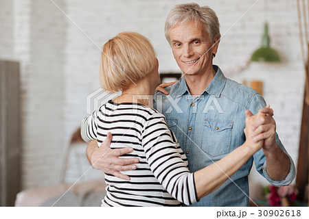 Excited active aged man dancing with his wife 30902618
