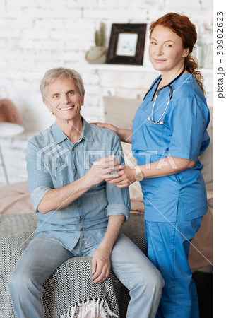 Proficient nurse providing medical assistance for 30902623