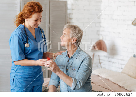 Qualified capable doctor assisting feeble man at 30902624