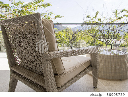 Wicker chair with view at terrace 30903729