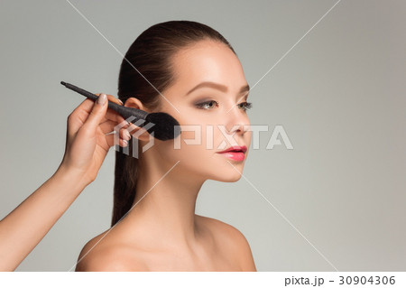 Beautiful female eyes with make-up and brush 30904306