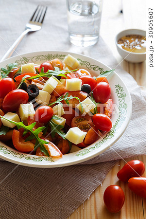 Plate of vegetable salad with cheese and arugula Plate of vegetable salad with cheese and arugula 30905607