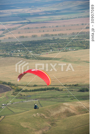 Paragliding in mountains Paragliding in mountains 30907089