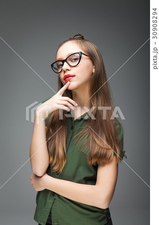 Young beautiful spectacled girl Young beautiful spectacled girl 30908294