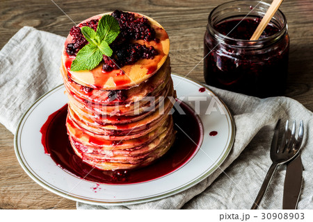 Stack of homemade american pancakes served with Stack of homemade american pancakes served with 30908903