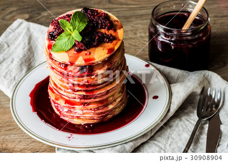 Stack of homemade american pancakes served with Stack of homemade american pancakes served with 30908904