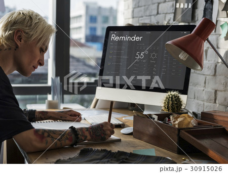 Woman checking appointment on personal organizer schedule Woman checking appointment on personal organizer schedule 30915026
