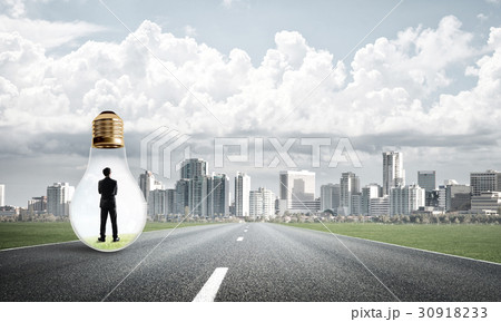Businessman inside light bulb 30918233