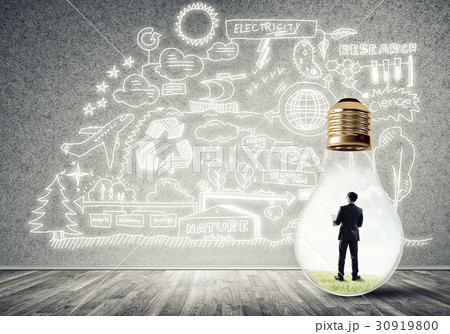 Businessman trapped in bulb Businessman trapped in bulb 30919800