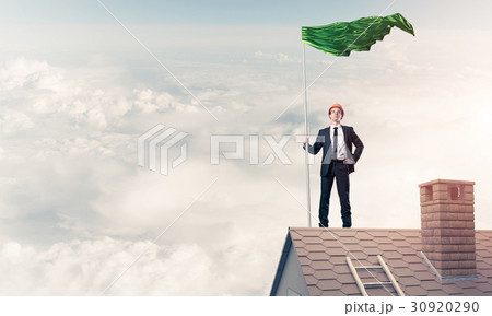 Young businessman with flag presenting concept of leadership. Mi Young businessman with flag presenting concept of leadership. Mi 30920290