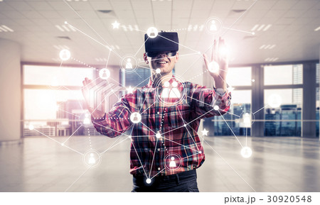 Guy wearing checked shirt and virtual mask reaching hand to touch screen Guy wearing checked shirt and virtual mask reaching hand to touch screen 30920548