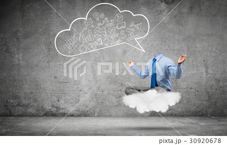 Headless businessman meditating 30920678