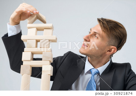 Businessman making tower 30921874