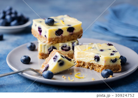 Blueberry bars, cake, cheesecake on a grey plate. 30924752