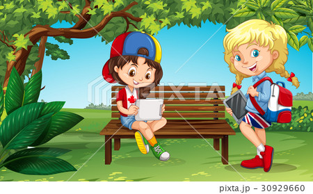 Two girls hanging out in the park 30929660