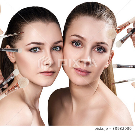 Two young women and makeup brushes. Two young women and makeup brushes. 30932080
