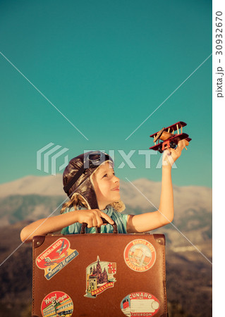 Happy child playing with toy airplane 30932670