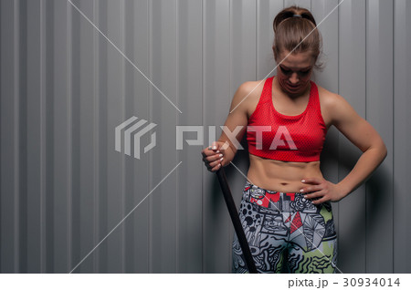 Portrait of sporty fit girl looking down Portrait of sporty fit girl looking down 30934014