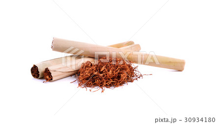Tobacco pile and cigarette on white background 30934180