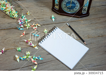 open note book with pencil on wood background open note book with pencil on wood background 30934715