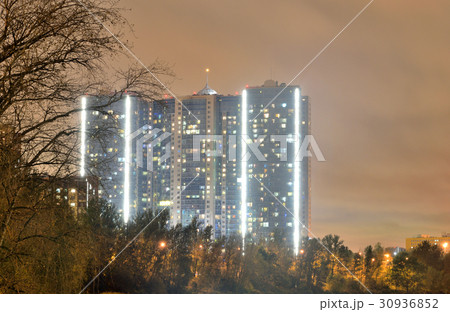 Contemporary residential skyscraper at night. 30936852