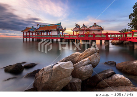 Chinese style pavilion in sea with twilight 30937948