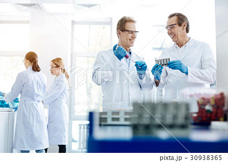 Two men discussing their invention 30938365
