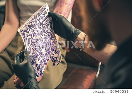 Man looking at image in room 30940051