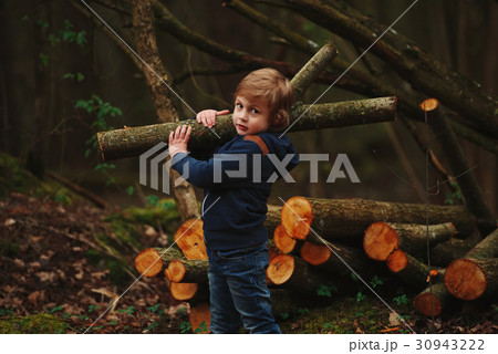 little sweet lumberjack in autumn forest little sweet lumberjack in autumn forest 30943222