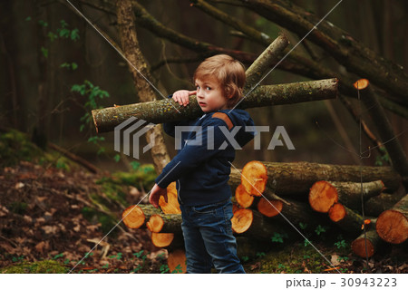 little sweet lumberjack in autumn forest 30943223