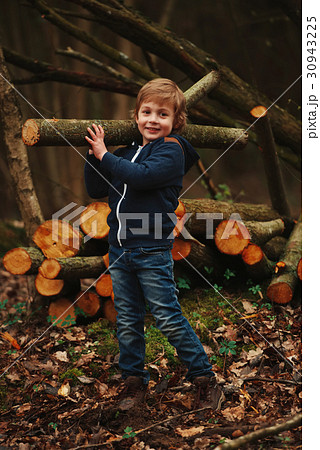 little sweet lumberjack in autumn forest little sweet lumberjack in autumn forest 30943225