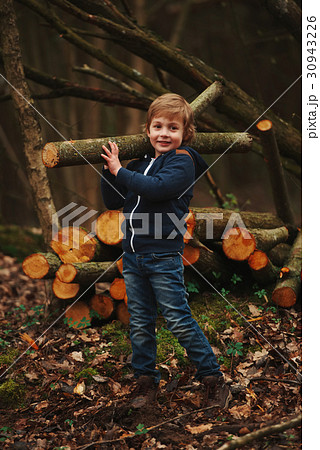 little sweet lumberjack in autumn forest 30943226