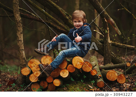 little sweet lumberjack in autumn forest little sweet lumberjack in autumn forest 30943227