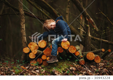 little sweet lumberjack in autumn forest little sweet lumberjack in autumn forest 30943228