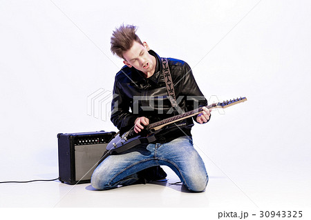 young expressive rock musician playing electric 30943325