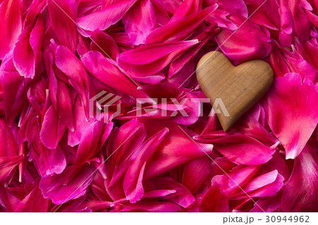 Heart on peony petals background. Heart on peony petals background. 30944962