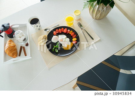 Breakfast with poached eggs Breakfast with poached eggs 30945834