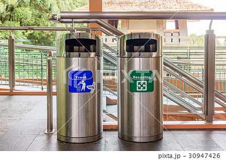 Stainless steel trash and recycle bins.  30947426