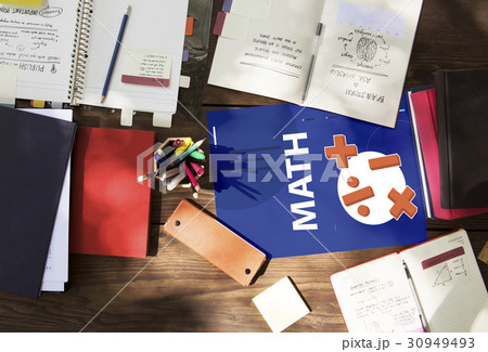 Aerial view of mathematics solution lessons on wooden table 30949493