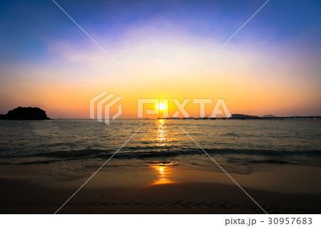 Beautiful sunset with reflection in the sea Beautiful sunset with reflection in the sea 30957683