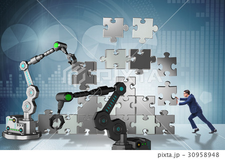 Businessman doing jigsaw puzzle with robotic arm 30958948