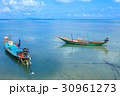Long tail boat floating on the sea 30961273