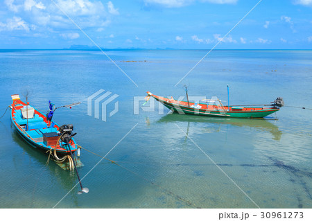 Long tail boat floating on the sea 30961273